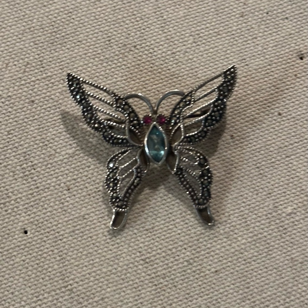 Unique ansilver butterfly with aquamarine and rubies. Can be used as pendant.